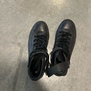Black leather high top chuck Taylor’s